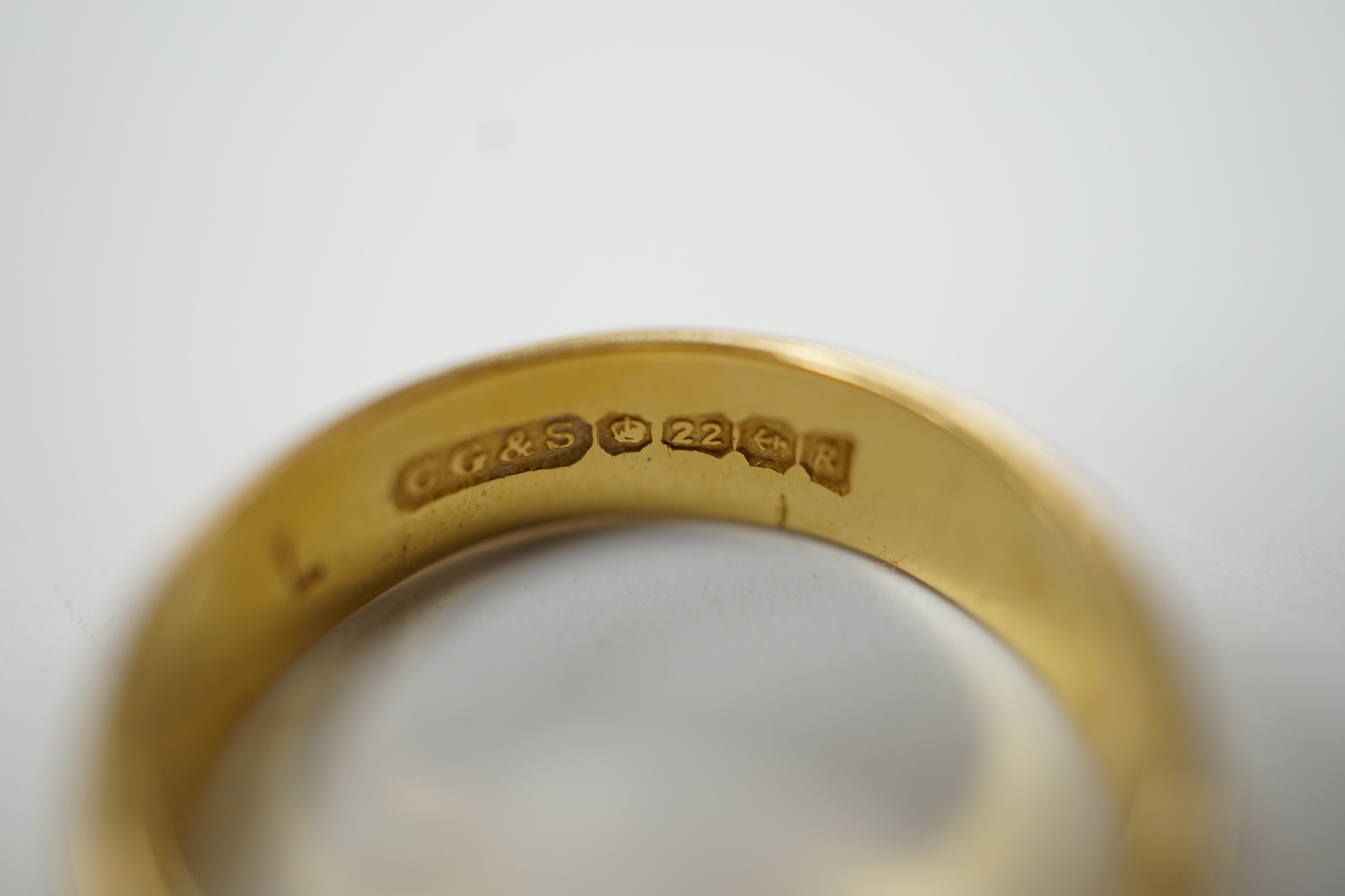A 22ct gold wedding band, size K/L, 5 grams. Fair condition.